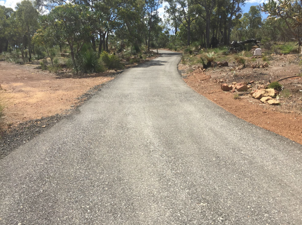 This is a photo of a hot spray & seal bitumen driveway which is in the process of being installed by Heatherton Road Tech